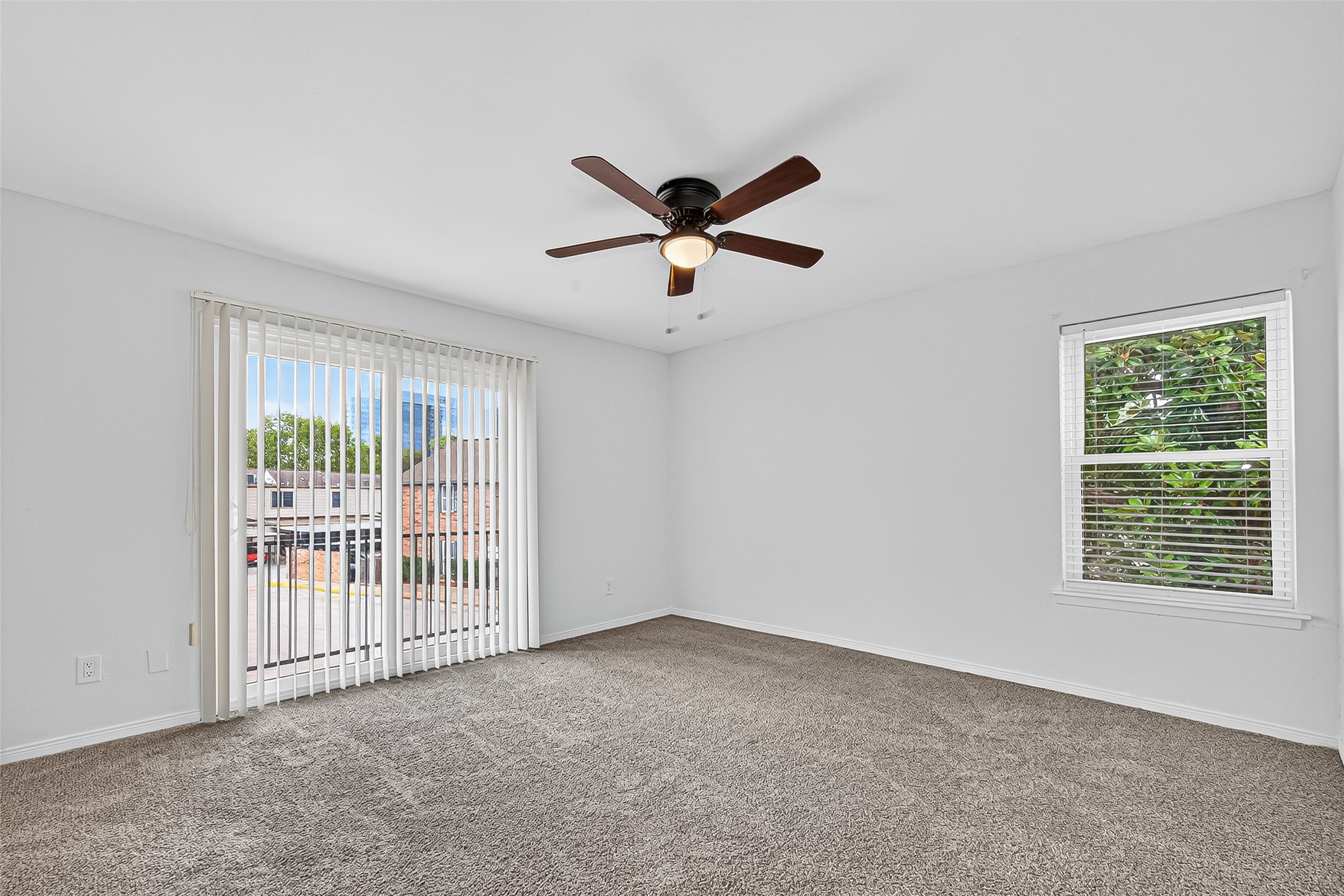 830 Threadneedle Street, Unit 240 Houston, TX 77079 - Photo 18 of 31 a view of a livingroom with a ceiling fan and window