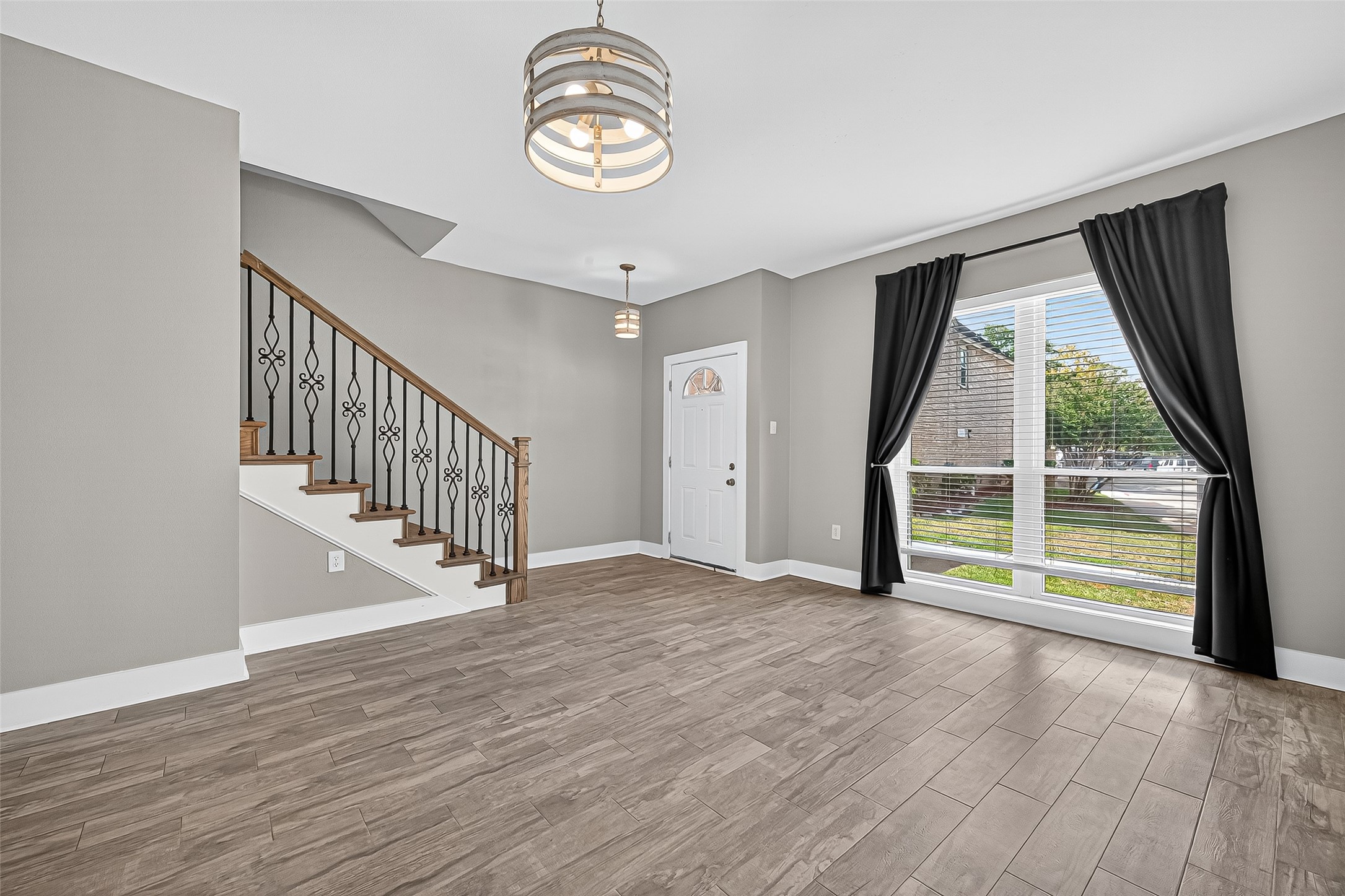 830 Threadneedle Street, Unit 240 Houston, TX 77079 - Photo 2 of 31 an empty room with wooden floor and windows
