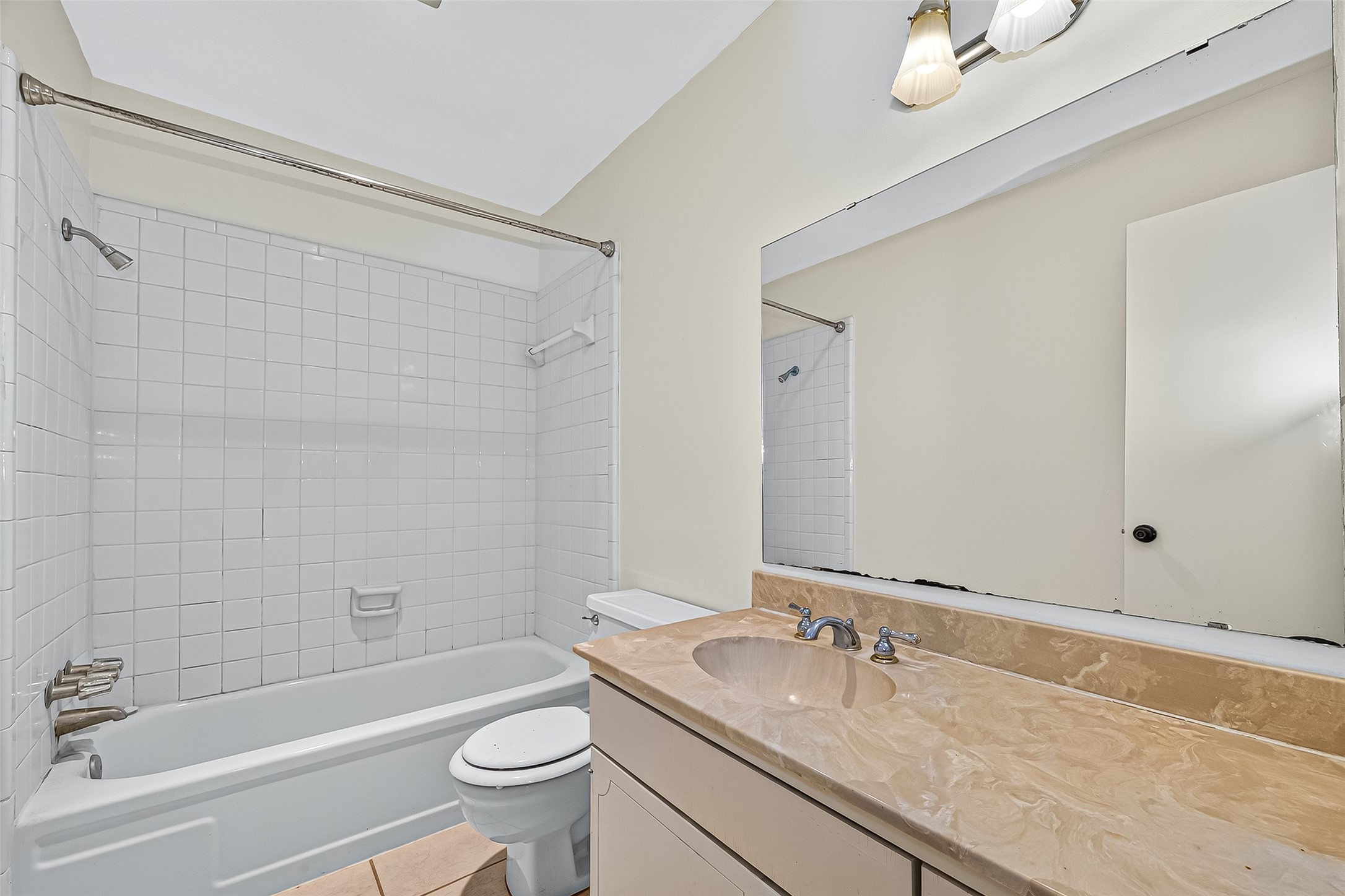 830 Threadneedle Street, Unit 240 Houston, TX 77079 - Photo 22 of 31 a bathroom with a granite countertop sink a toilet and shower