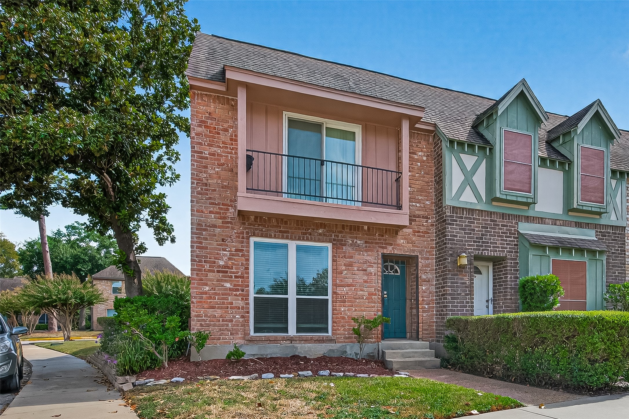 830 Threadneedle Street, Unit 240 Houston, TX 77079 - Photo 23 of 31 a front view of a house with a yard