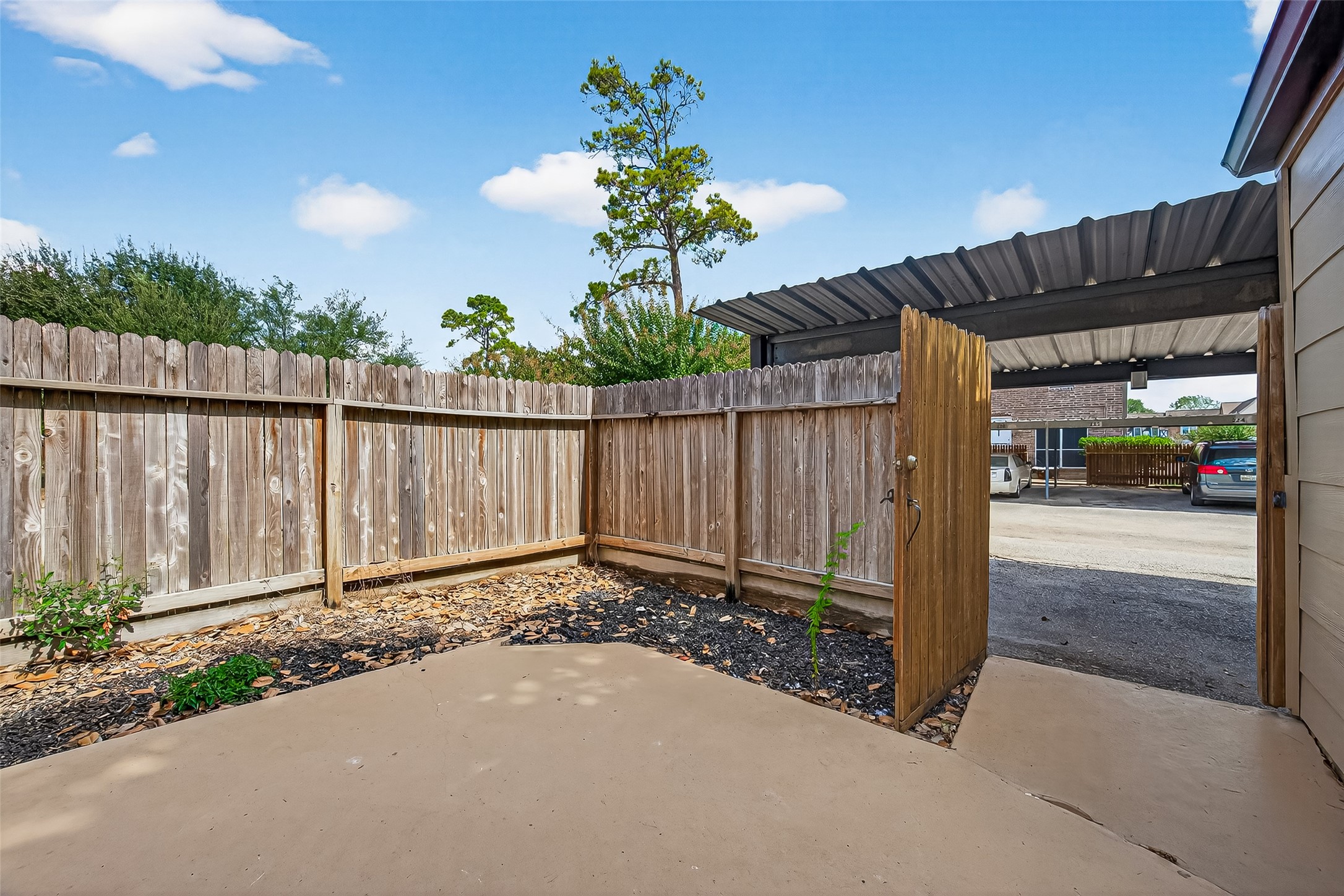 830 Threadneedle Street, Unit 240 Houston, TX 77079 - Photo 28 of 31 a view of a street with wooden fence