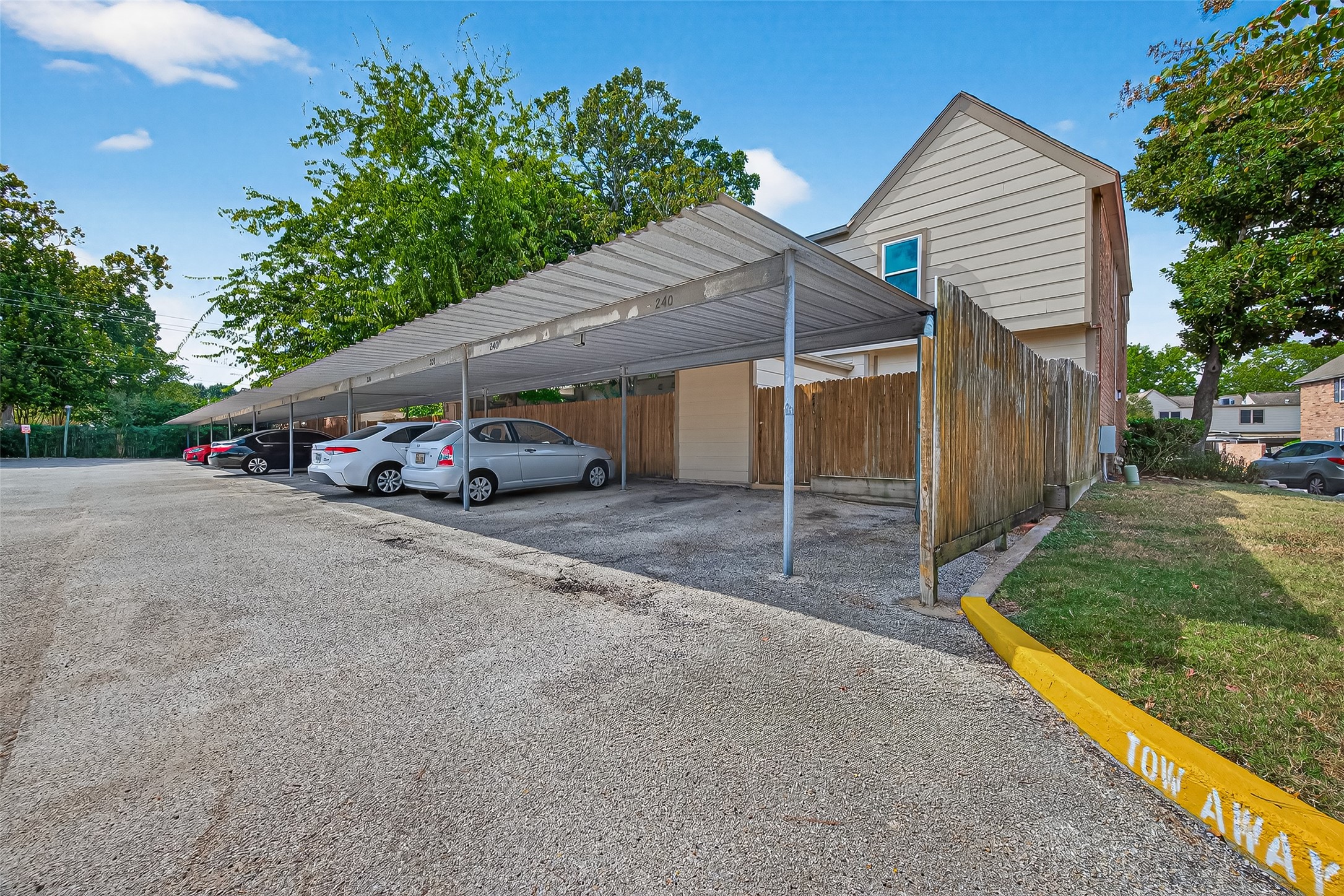 830 Threadneedle Street, Unit 240 Houston, TX 77079 - Photo 30 of 31 a car parked in front of white house