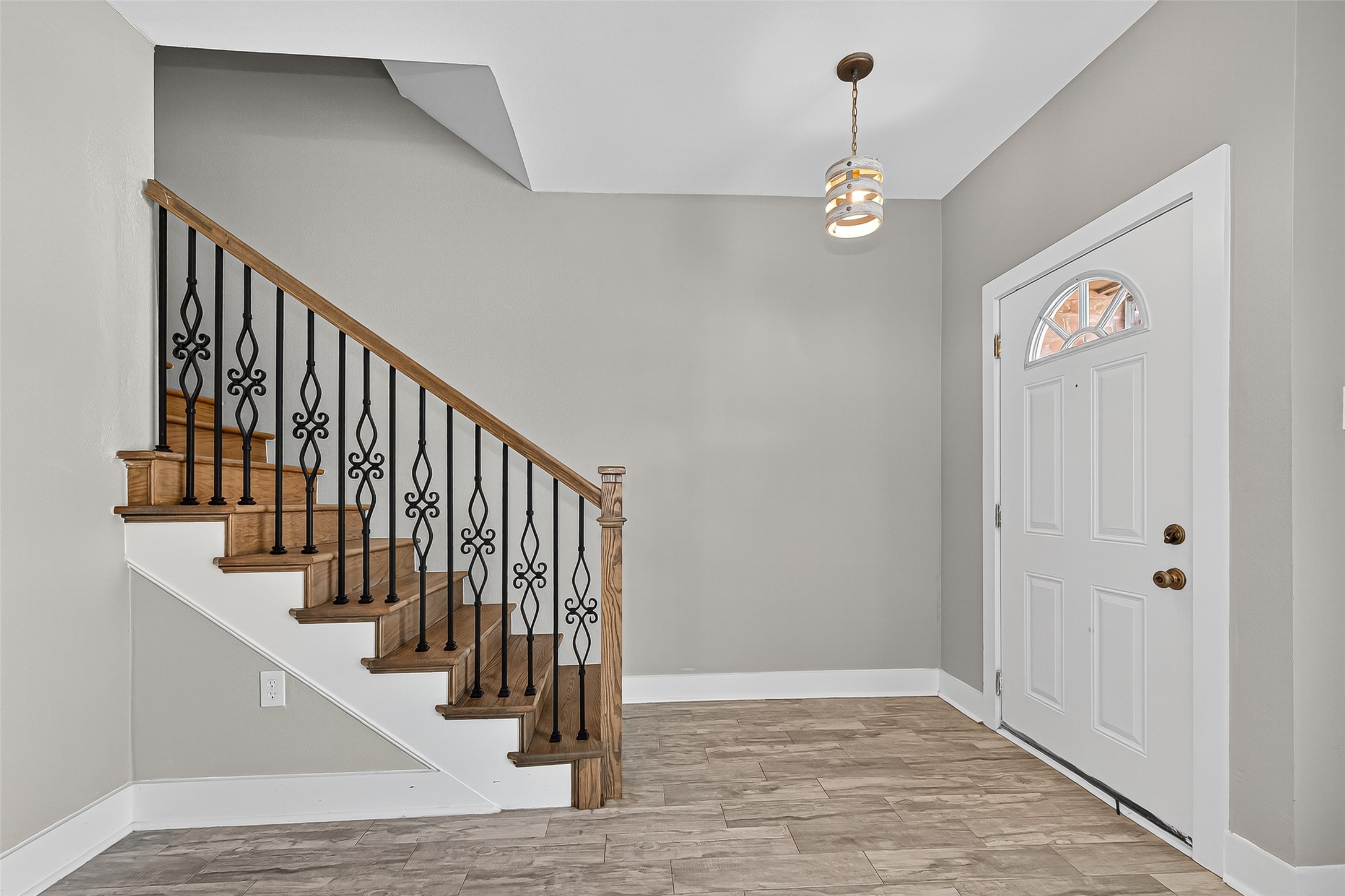 830 Threadneedle Street, Unit 240 Houston, TX 77079 - Photo 7 of 31 a view of a hallway with wooden floor and staircase
