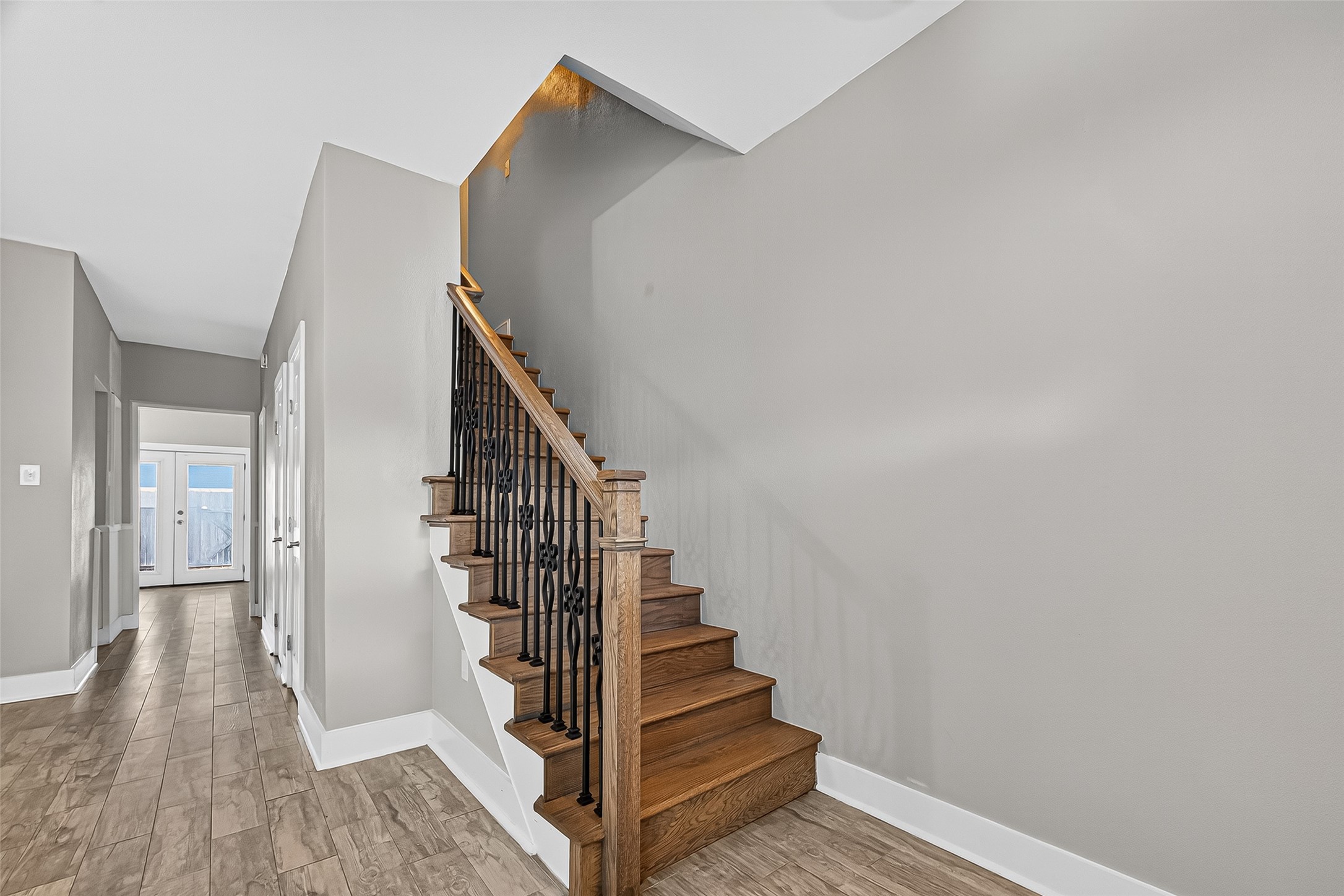 830 Threadneedle Street, Unit 240 Houston, TX 77079 - Photo 8 of 31 a view of entryway with wooden floor and stairs