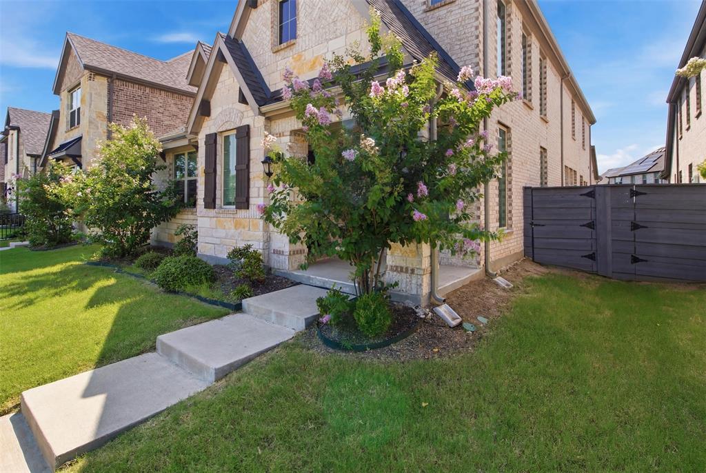 7416 Sequoia Rdg Road Little Elm, TX 76227 - Photo 3 of 37 Stone and brick facade featuring dark shutters