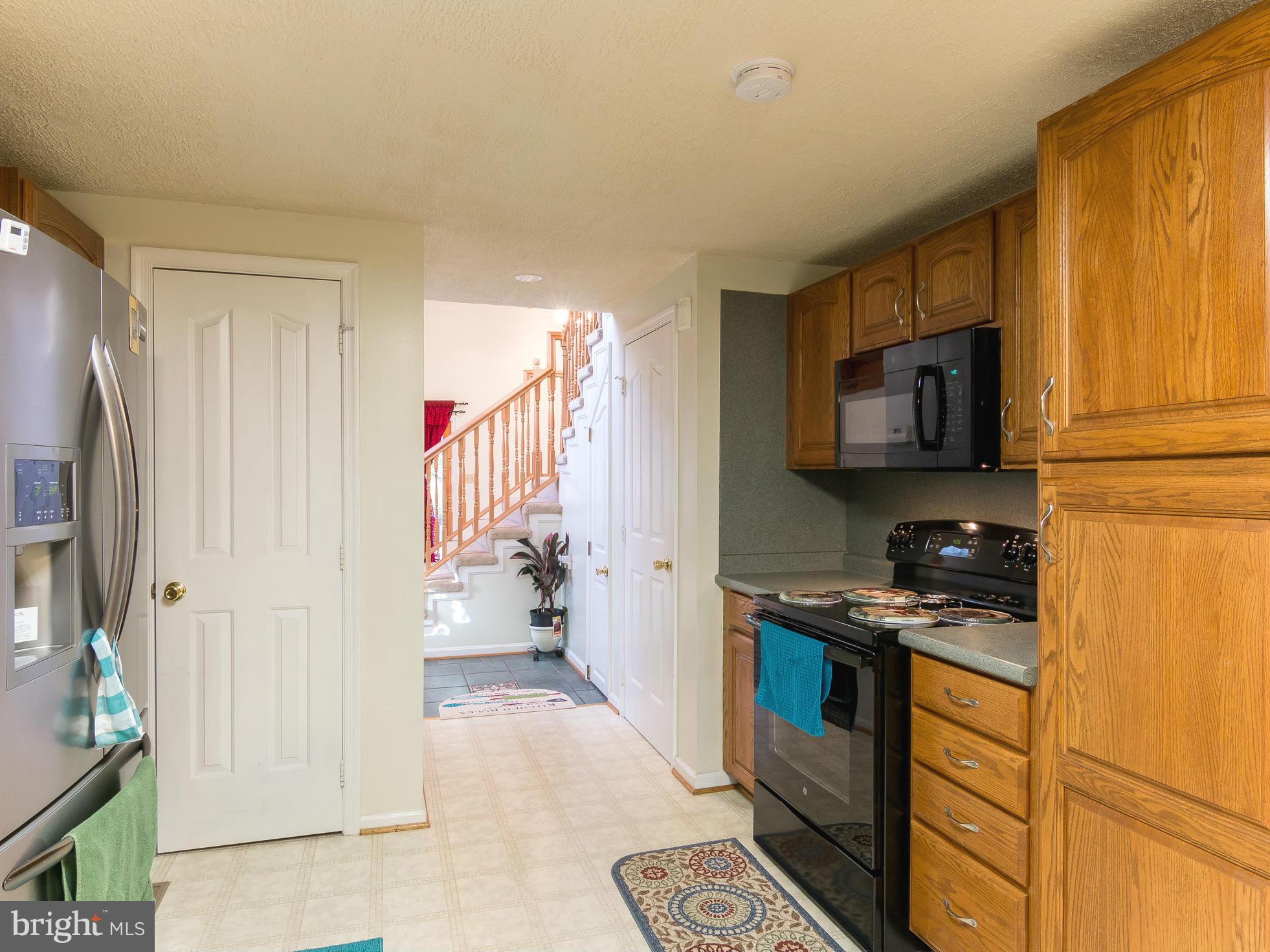8807 Indian Springs Road Frederick, MD 21702 - Photo 11 of 27 a kitchen with a sink stove and refrigerator