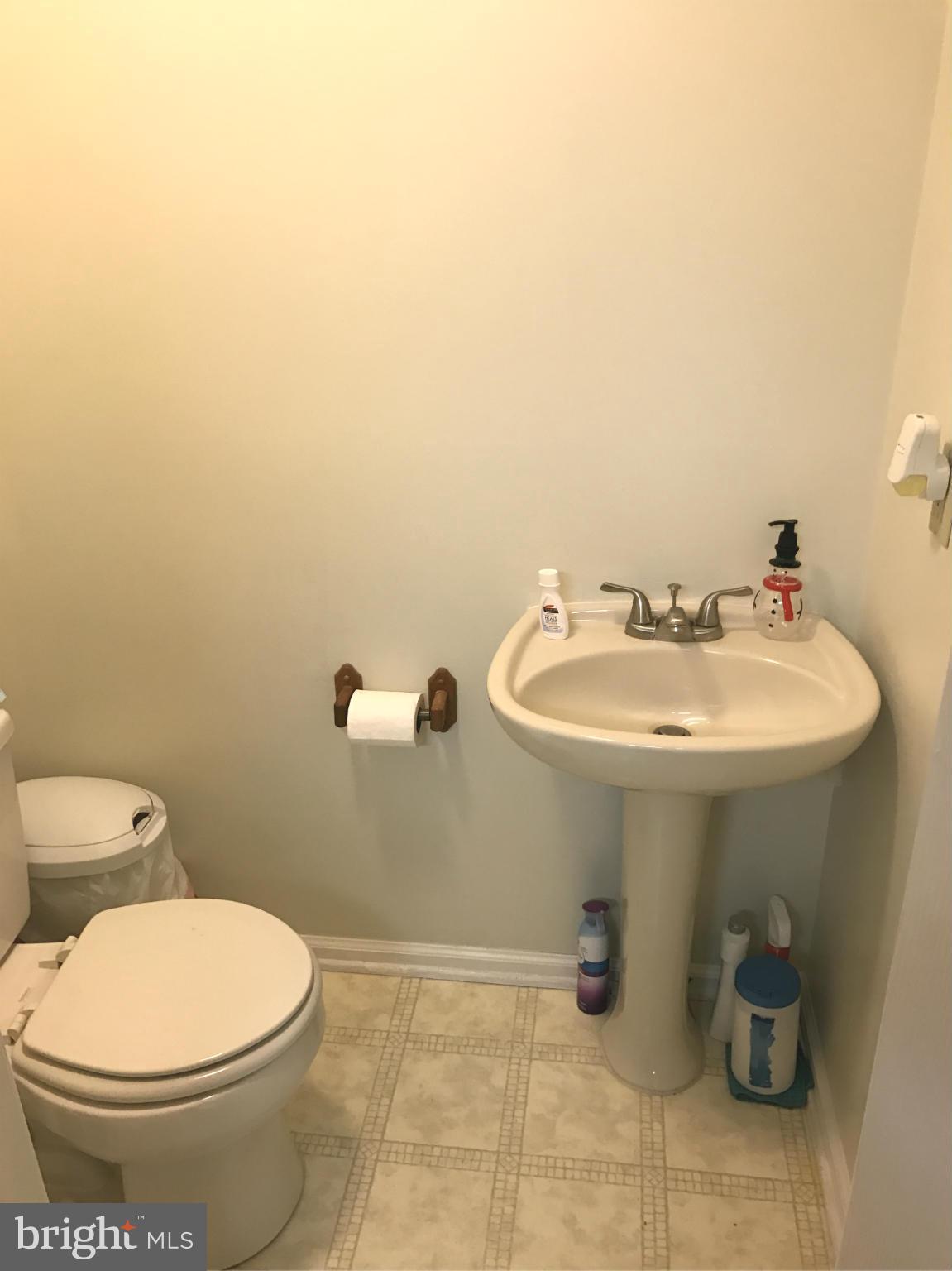 8807 Indian Springs Road Frederick, MD 21702 - Photo 12 of 27 a bathroom with a sink a toilet and mirror