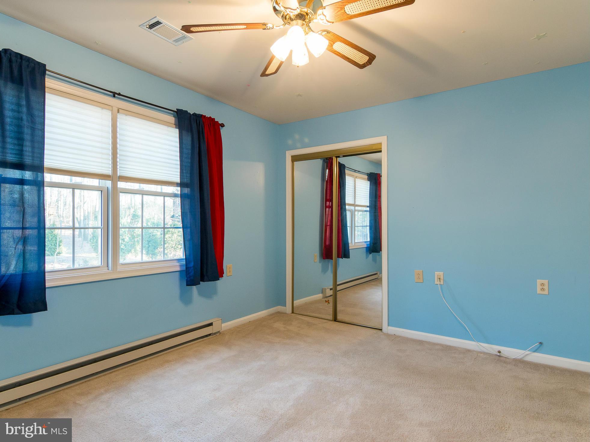 8807 Indian Springs Road Frederick, MD 21702 - Photo 18 of 27 an empty room with fan and windows