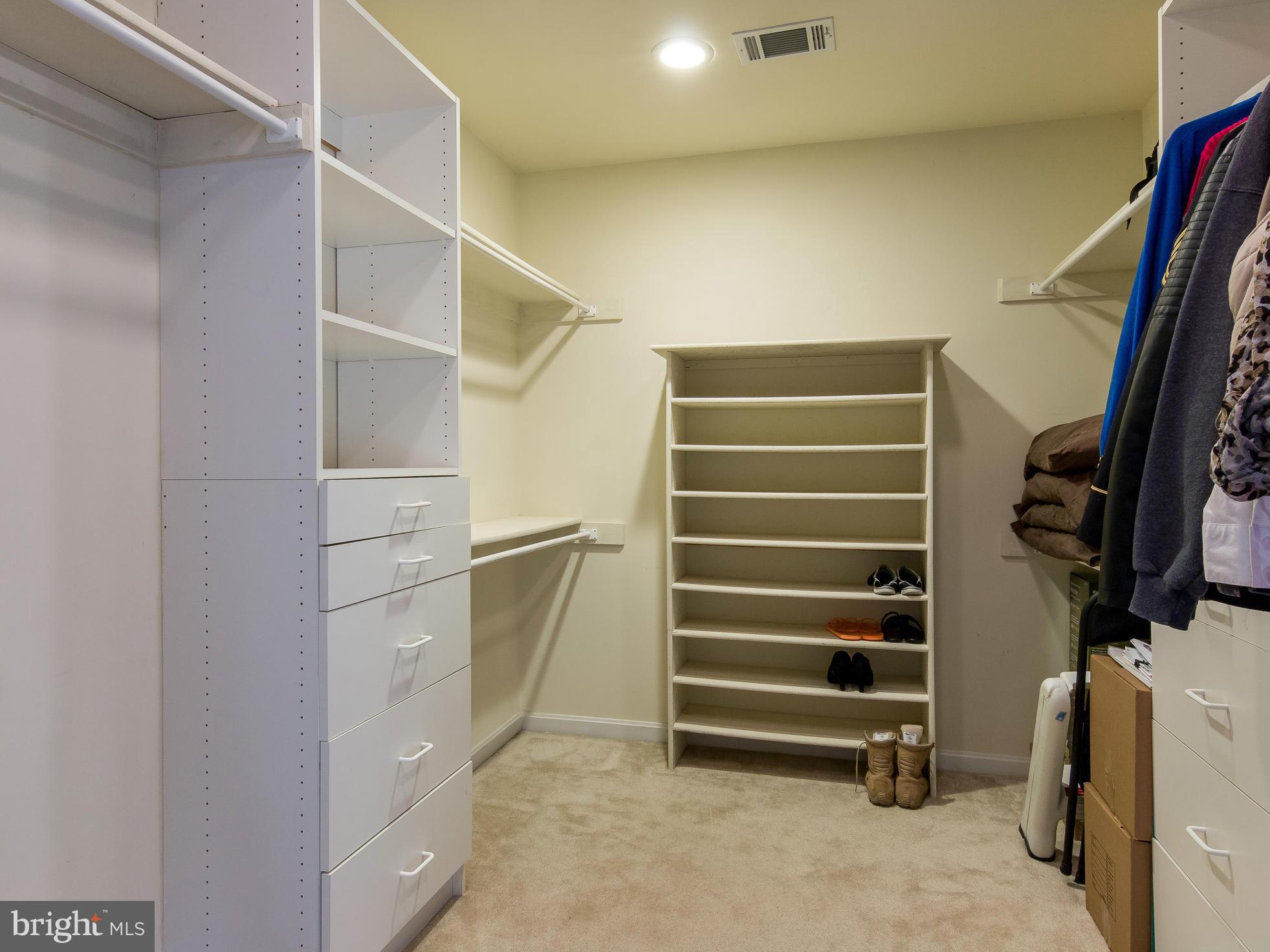 8807 Indian Springs Road Frederick, MD 21702 - Photo 21 of 27 a view of walk in closet with clothes and shoes