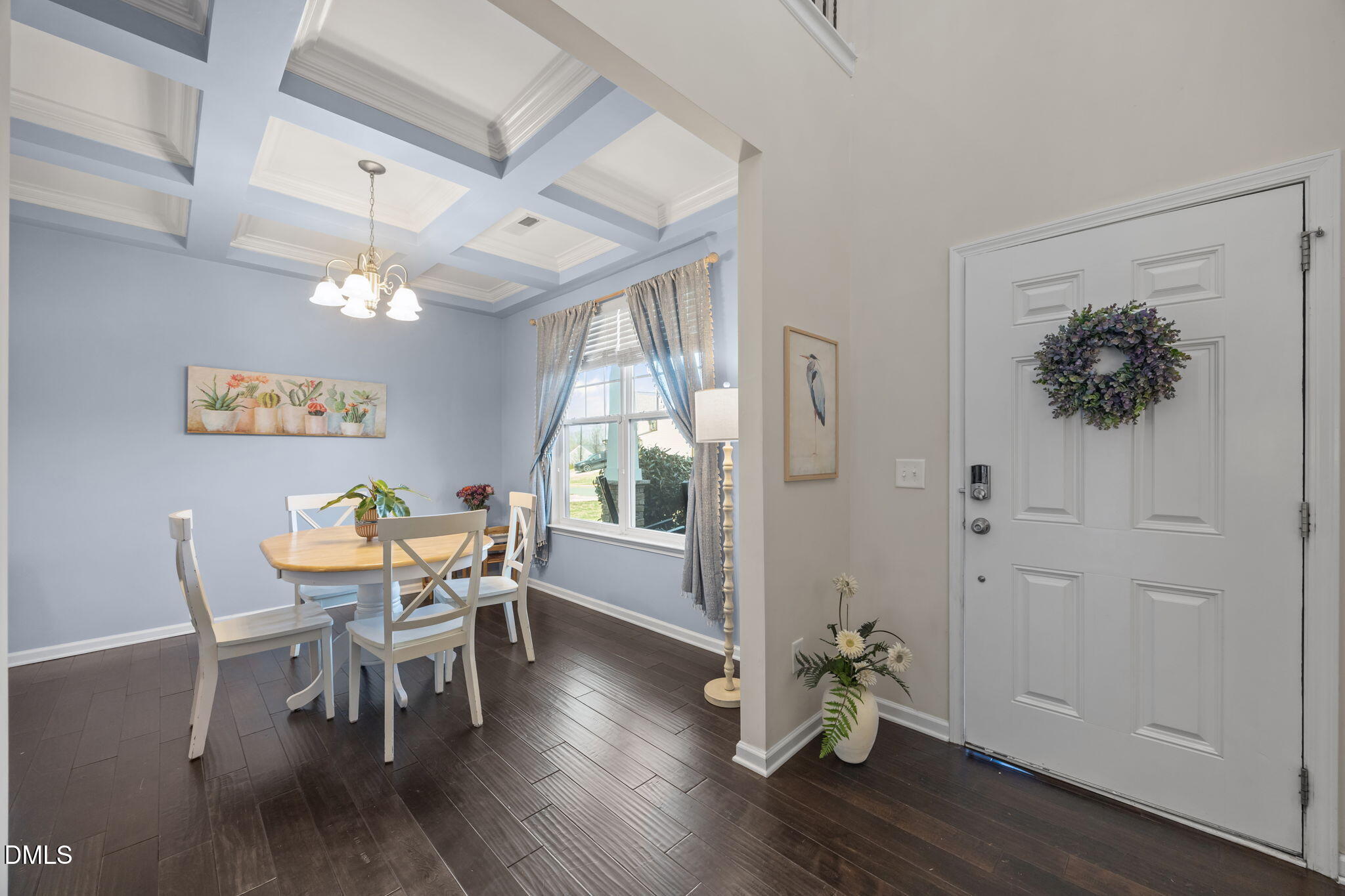 2329 Longshadow Drive Graham, NC 27253 - Photo 14 of 52 a dining room with furniture potted plants and wooden floor