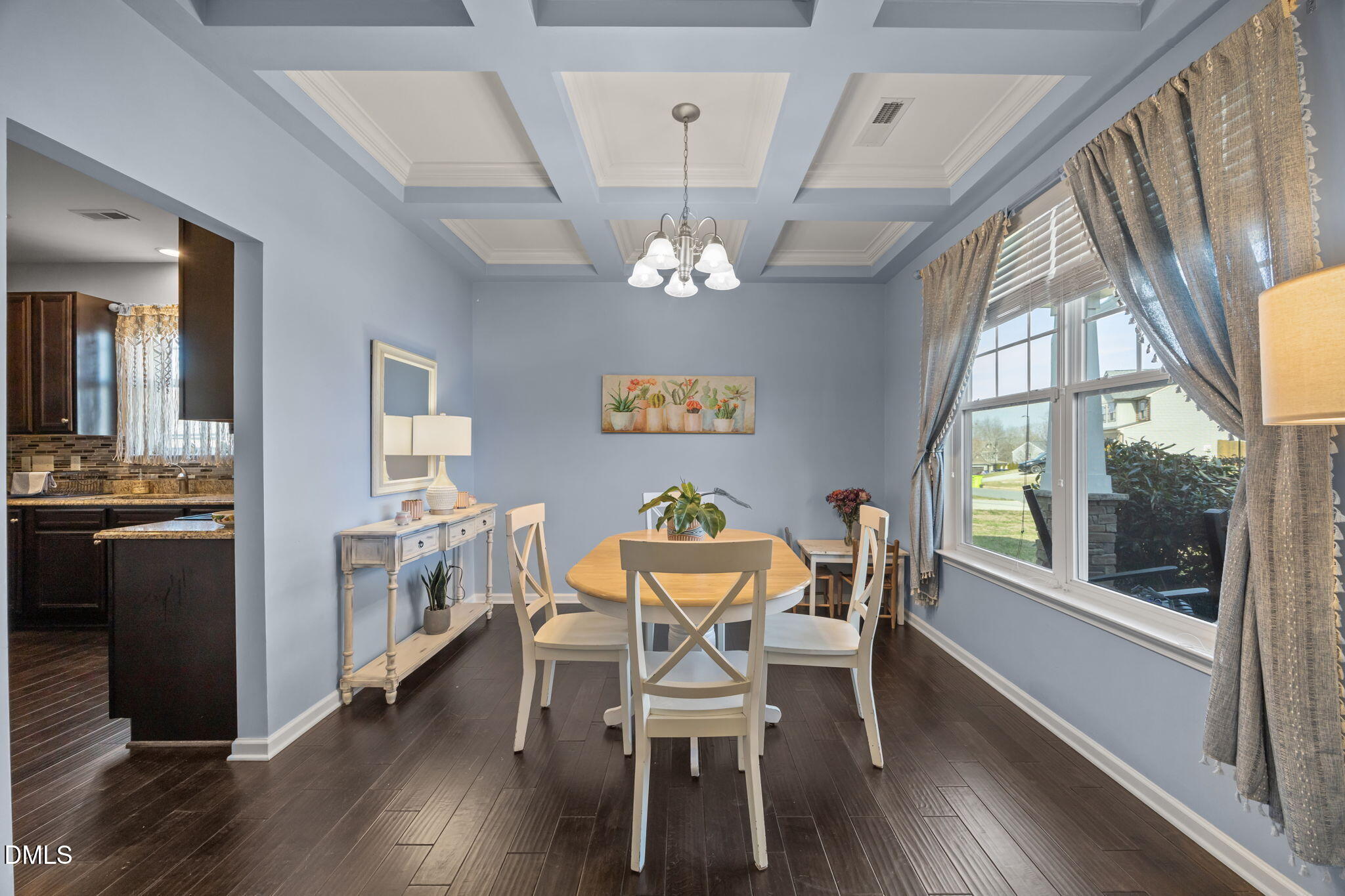 2329 Longshadow Drive Graham, NC 27253 - Photo 15 of 52 a view of a dining room with furniture a chandelier and wooden floor