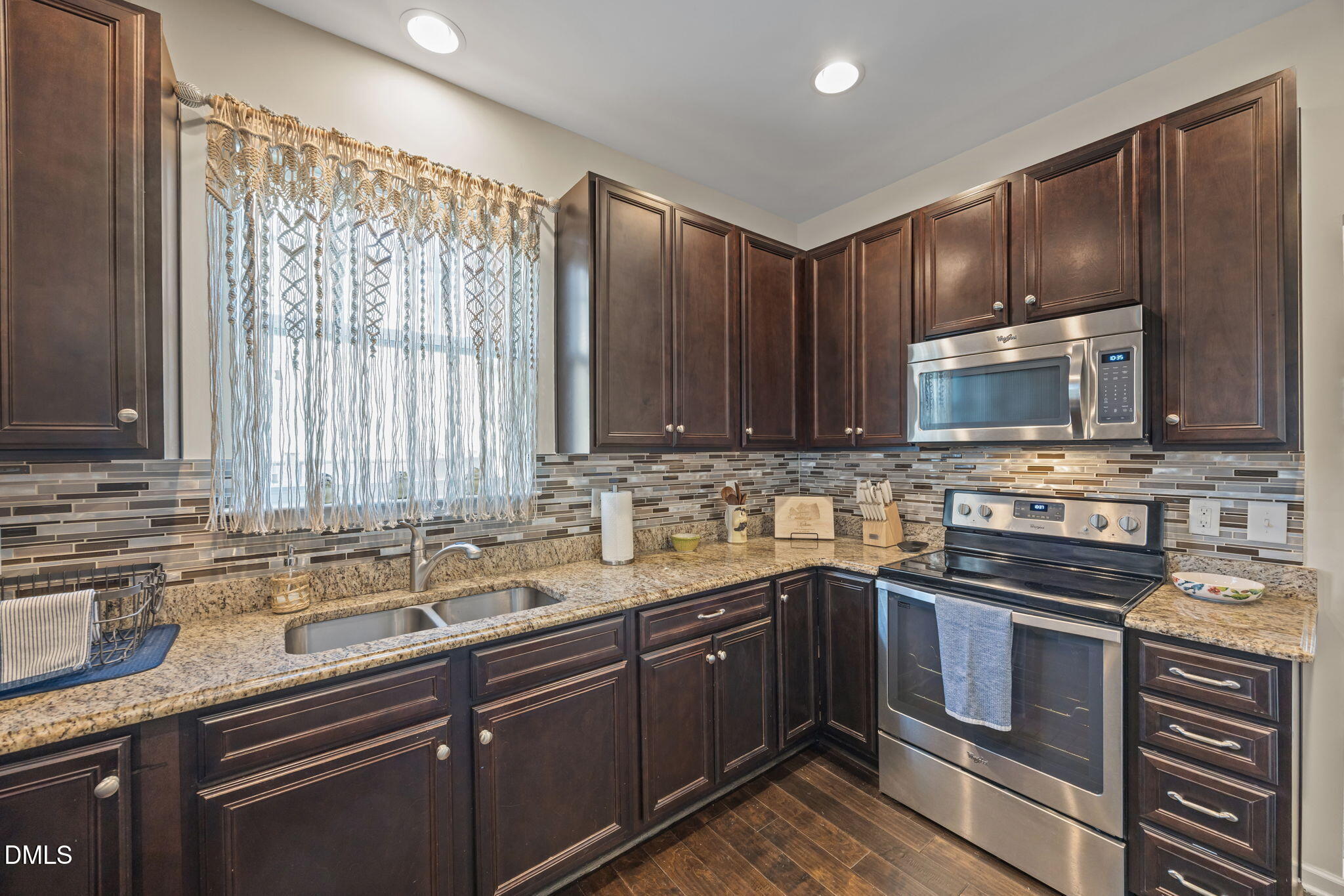 2329 Longshadow Drive Graham, NC 27253 - Photo 18 of 52 a kitchen with a sink stove top oven and refrigerator