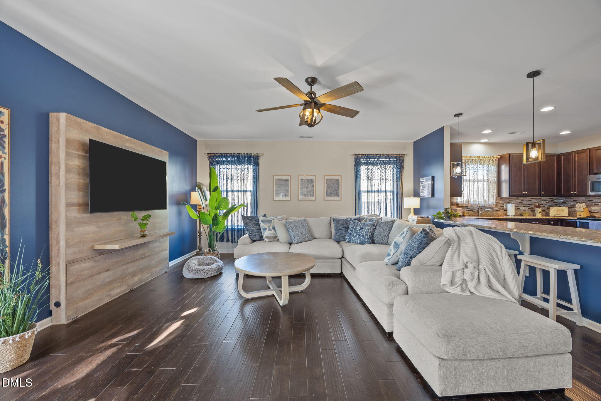 2329 Longshadow Drive Graham, NC 27253 - Photo 23 of 52 a living room with furniture and a flat screen tv