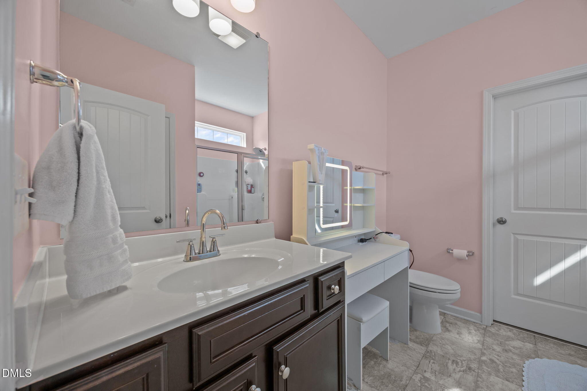 2329 Longshadow Drive Graham, NC 27253 - Photo 28 of 52 a bathroom with a granite countertop sink a toilet a mirror and shower