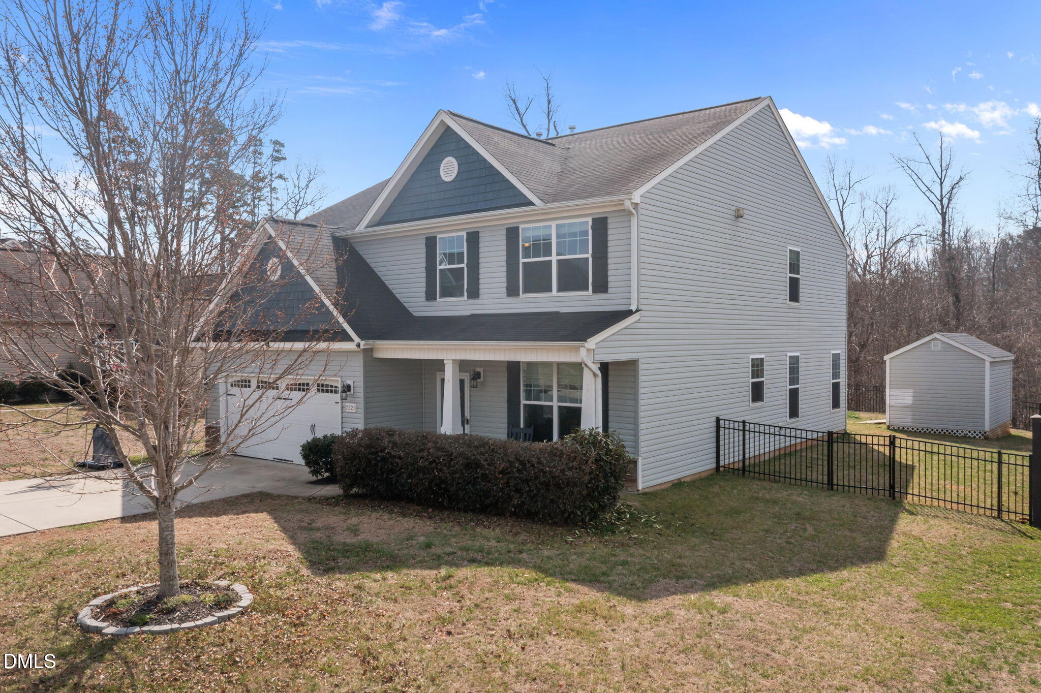 2329 Longshadow Drive Graham, NC 27253 - Photo 2 of 52 a front view of a house with a yard and garage
