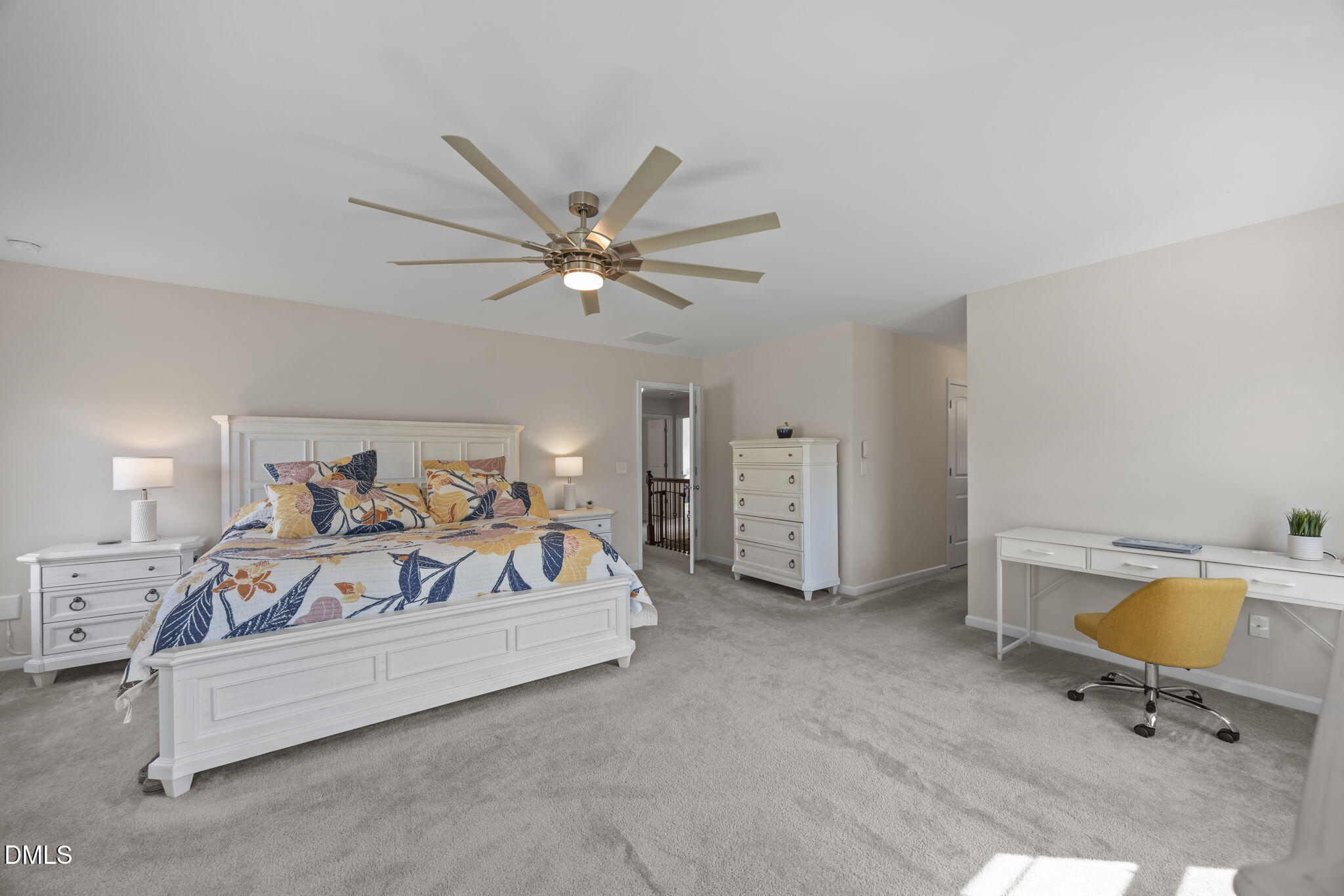 2329 Longshadow Drive Graham, NC 27253 - Photo 33 of 52 a spacious bedroom with a bed and a table