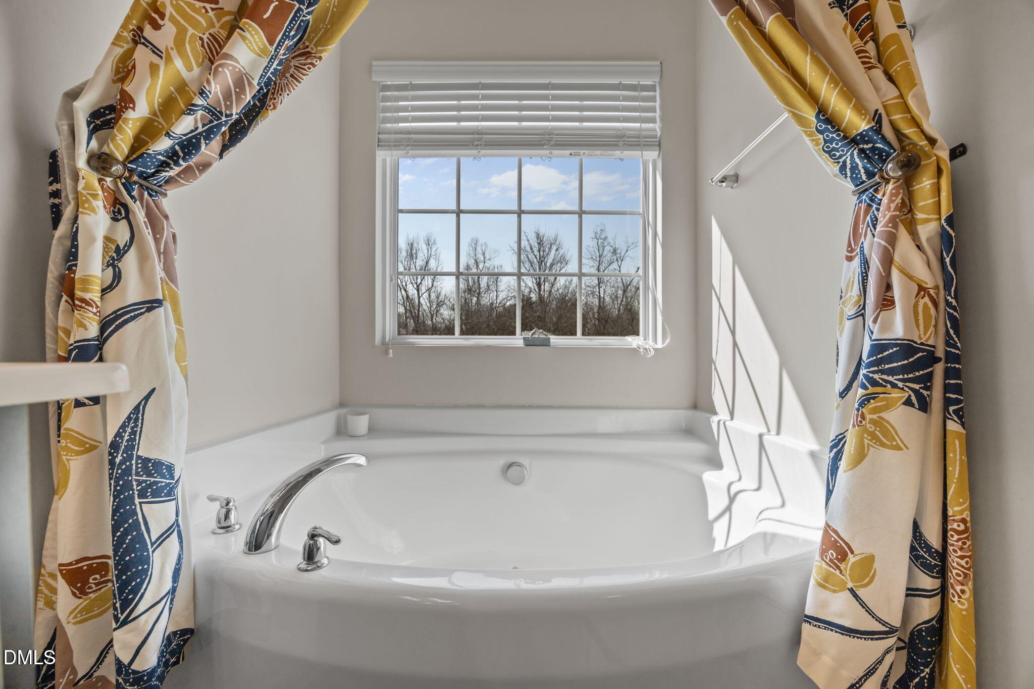 2329 Longshadow Drive Graham, NC 27253 - Photo 36 of 52 a bathroom with a bathtub and a window