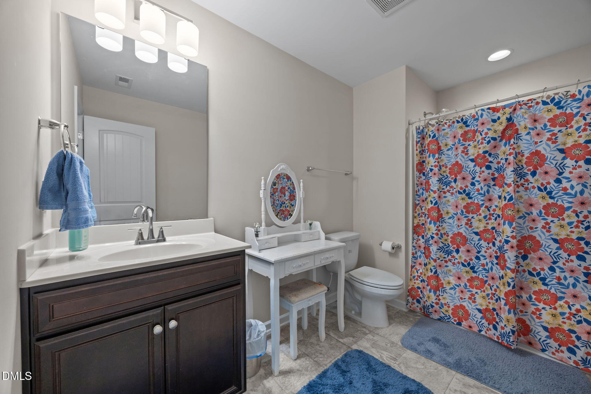 2329 Longshadow Drive Graham, NC 27253 - Photo 38 of 52 a bathroom with a sink toilet and a mirror