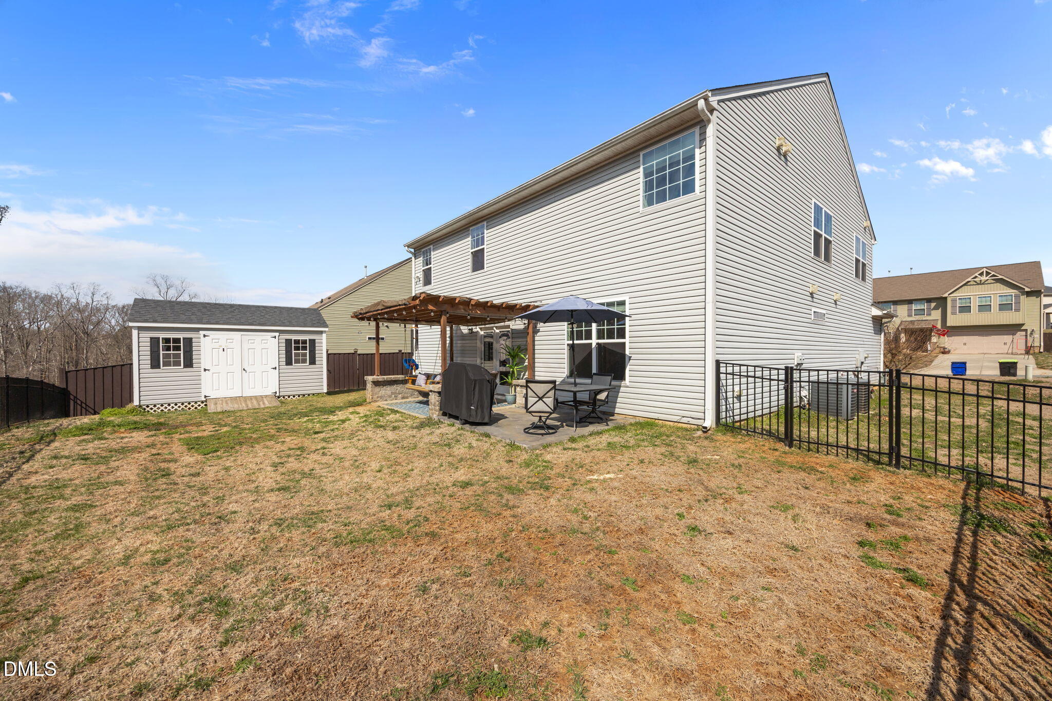 2329 Longshadow Drive Graham, NC 27253 - Photo 47 of 52 a view of a yard in front of a house with a large tree