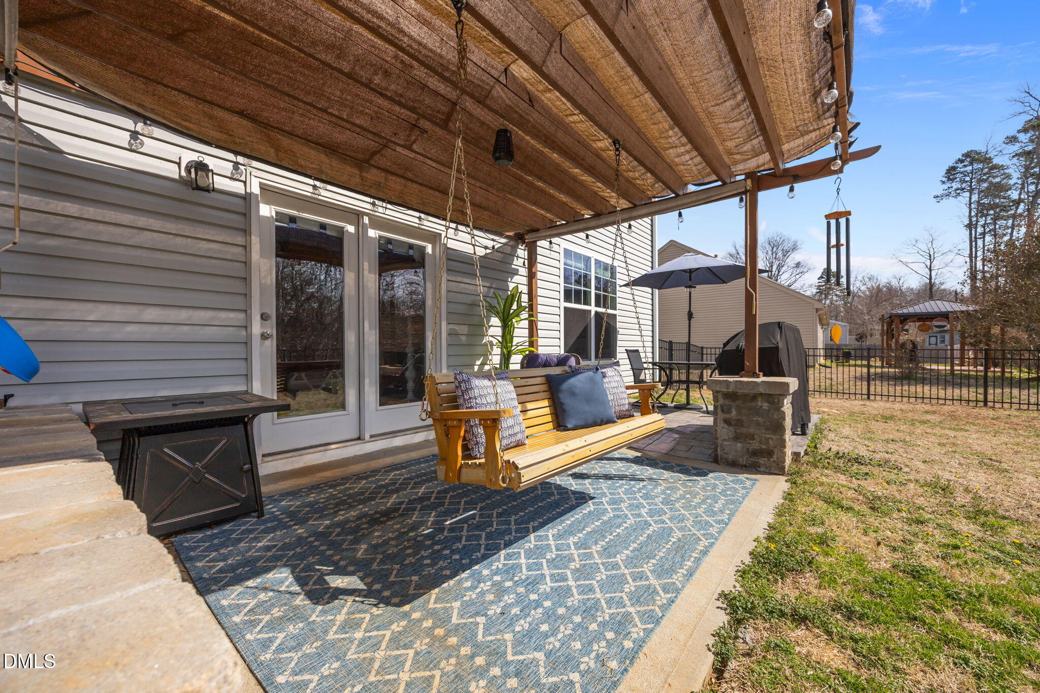 2329 Longshadow Drive Graham, NC 27253 - Photo 49 of 52 a view of a patio with table and chairs with wooden floor and fence