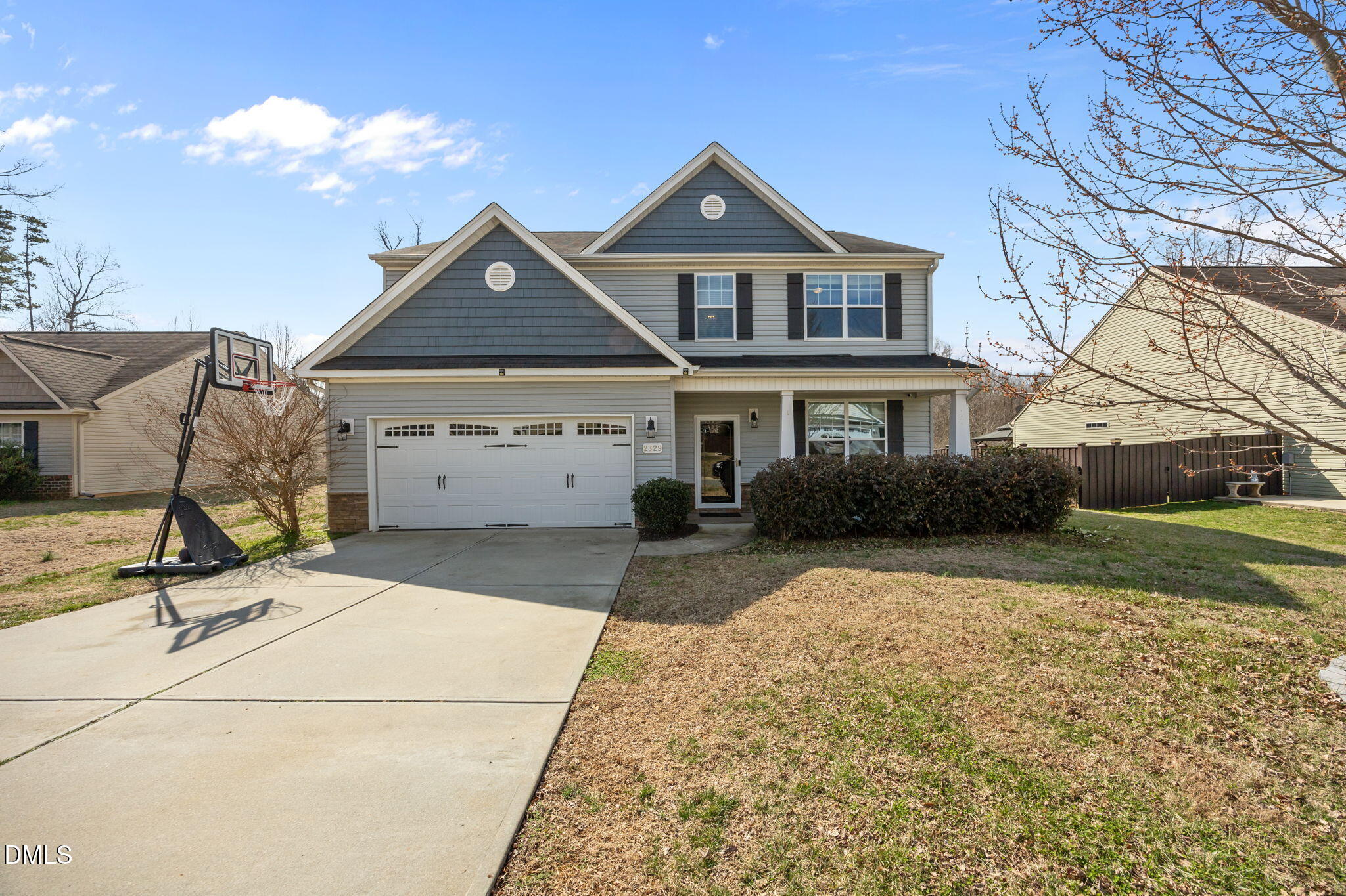 2329 Longshadow Drive Graham, NC 27253 - Photo 4 of 52 a front view of a house with garden