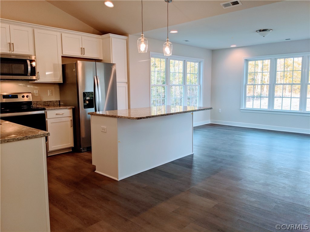 12006 Corte Castle Road Chesterfield, VA 23838 - Photo 8 of 41 a kitchen with stainless steel appliances granite countertop a refrigerator a sink dishwasher a stove and white countertops with wooden floor