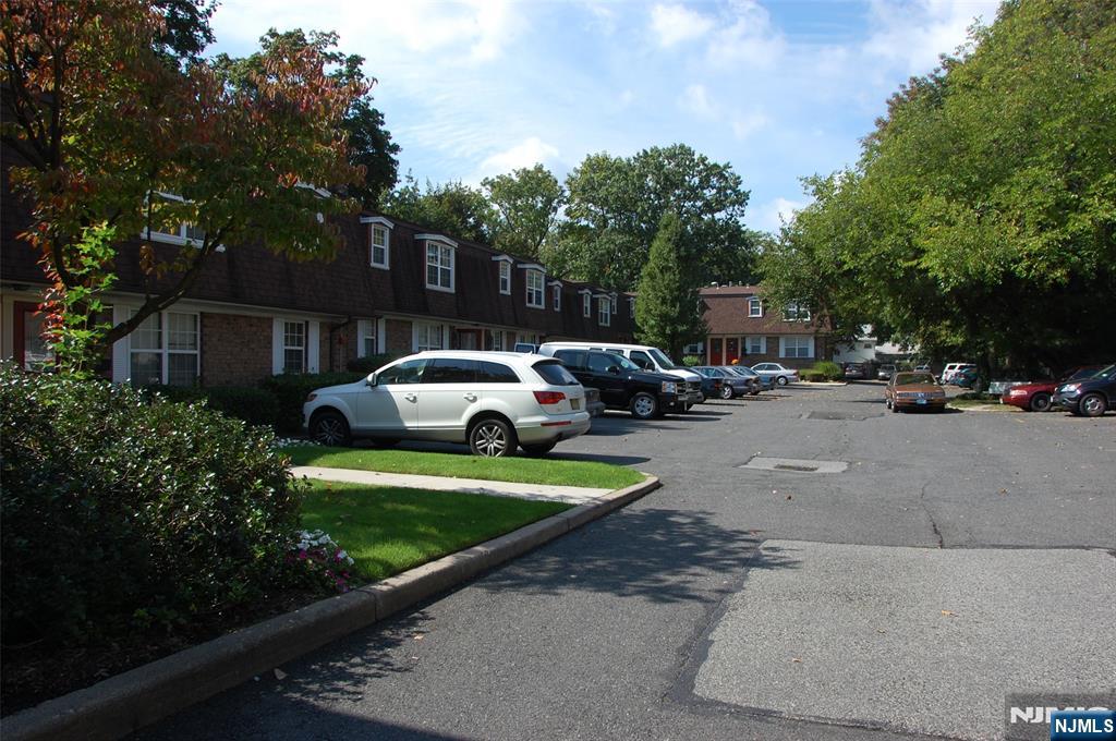 360 Knickerbocker Road, Unit 24 Dumont, NJ 07628 - Photo 7 of 8 a view of car parked on the side of a street