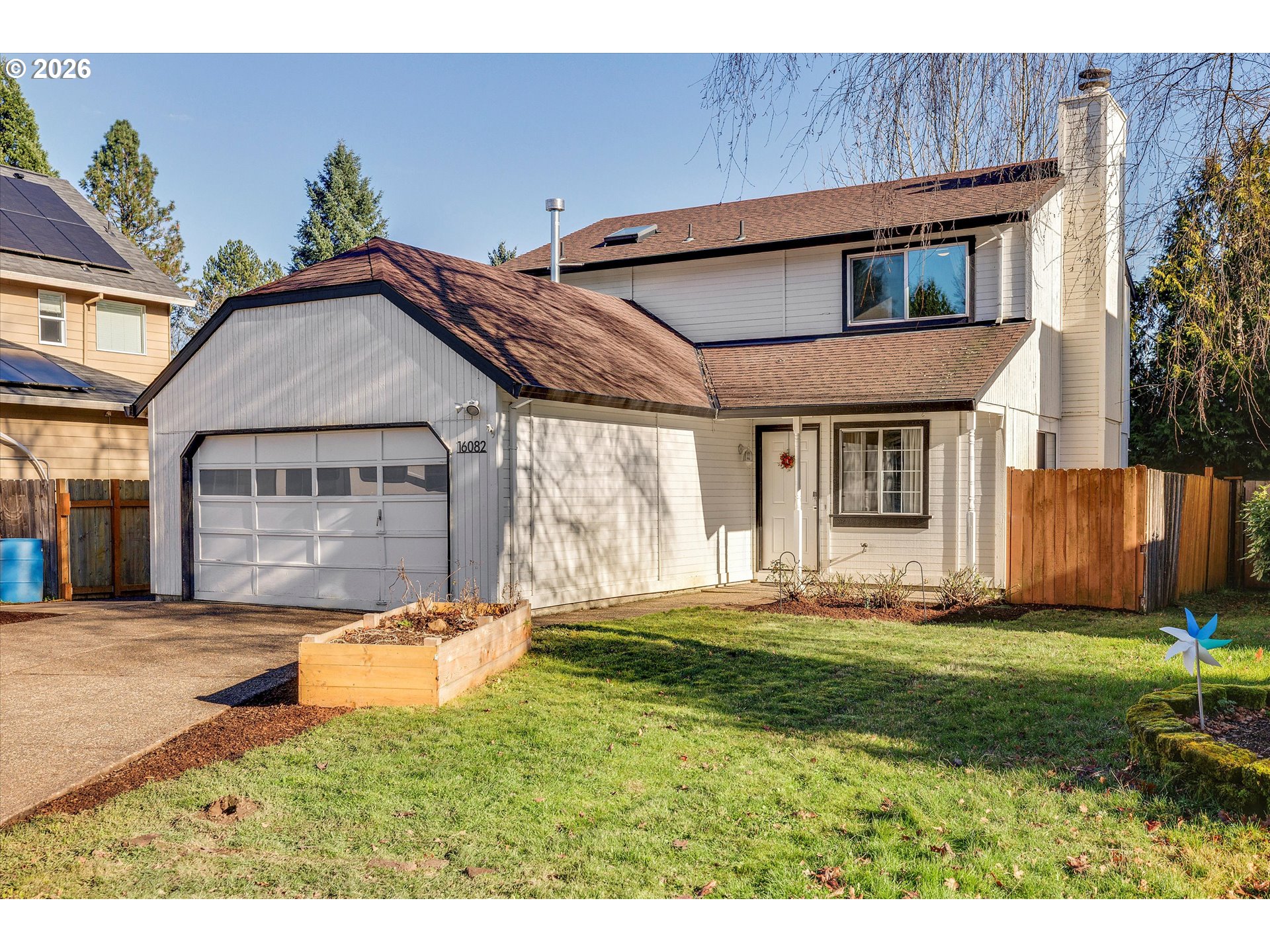 16082 Southwest 93rd Avenue Tigard, OR 97224 - Photo 1 of 35 a front view of a house with a yard
