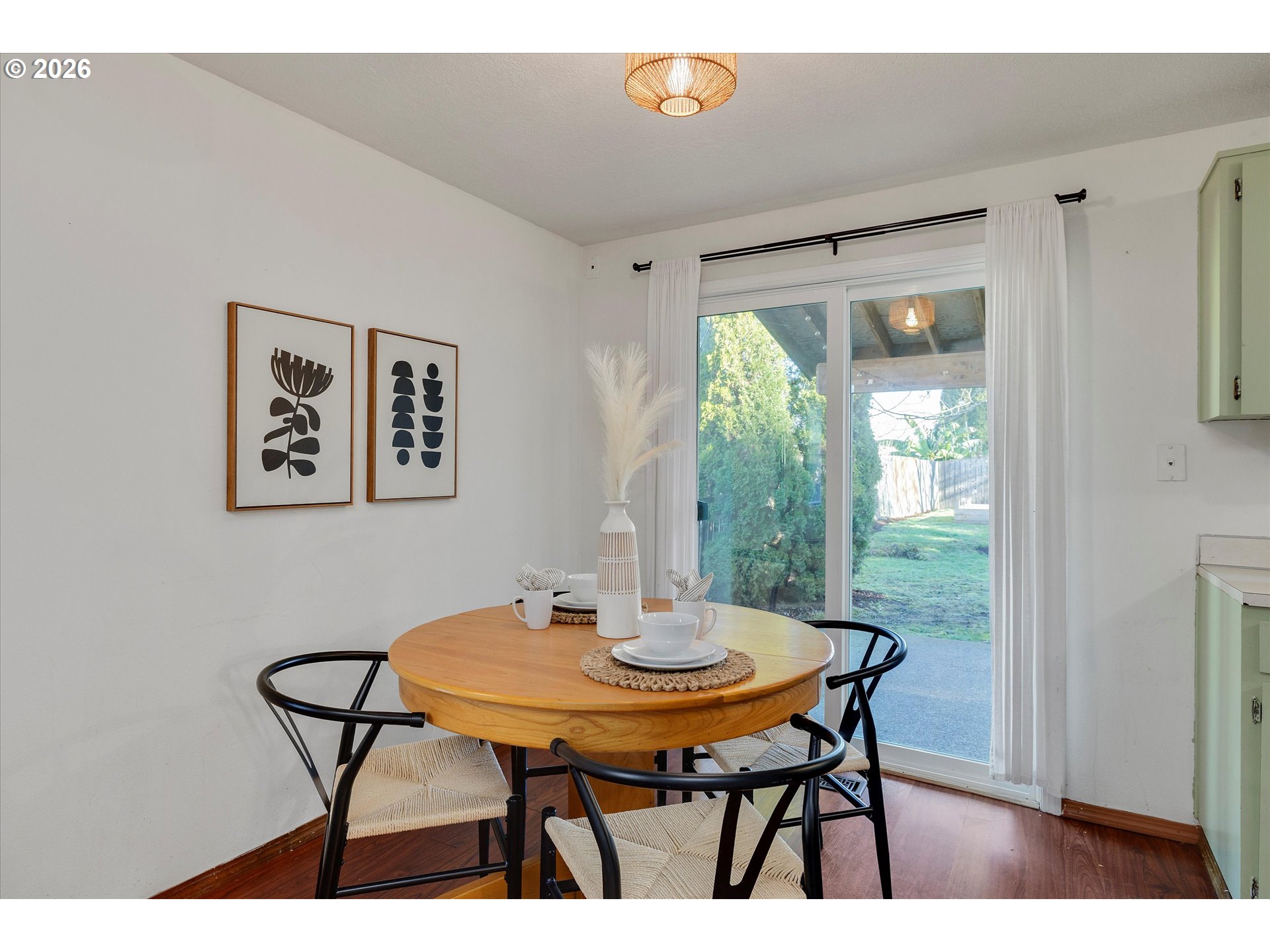 16082 Southwest 93rd Avenue Tigard, OR 97224 - Photo 14 of 35 a view of a dining room with furniture window and wooden floor