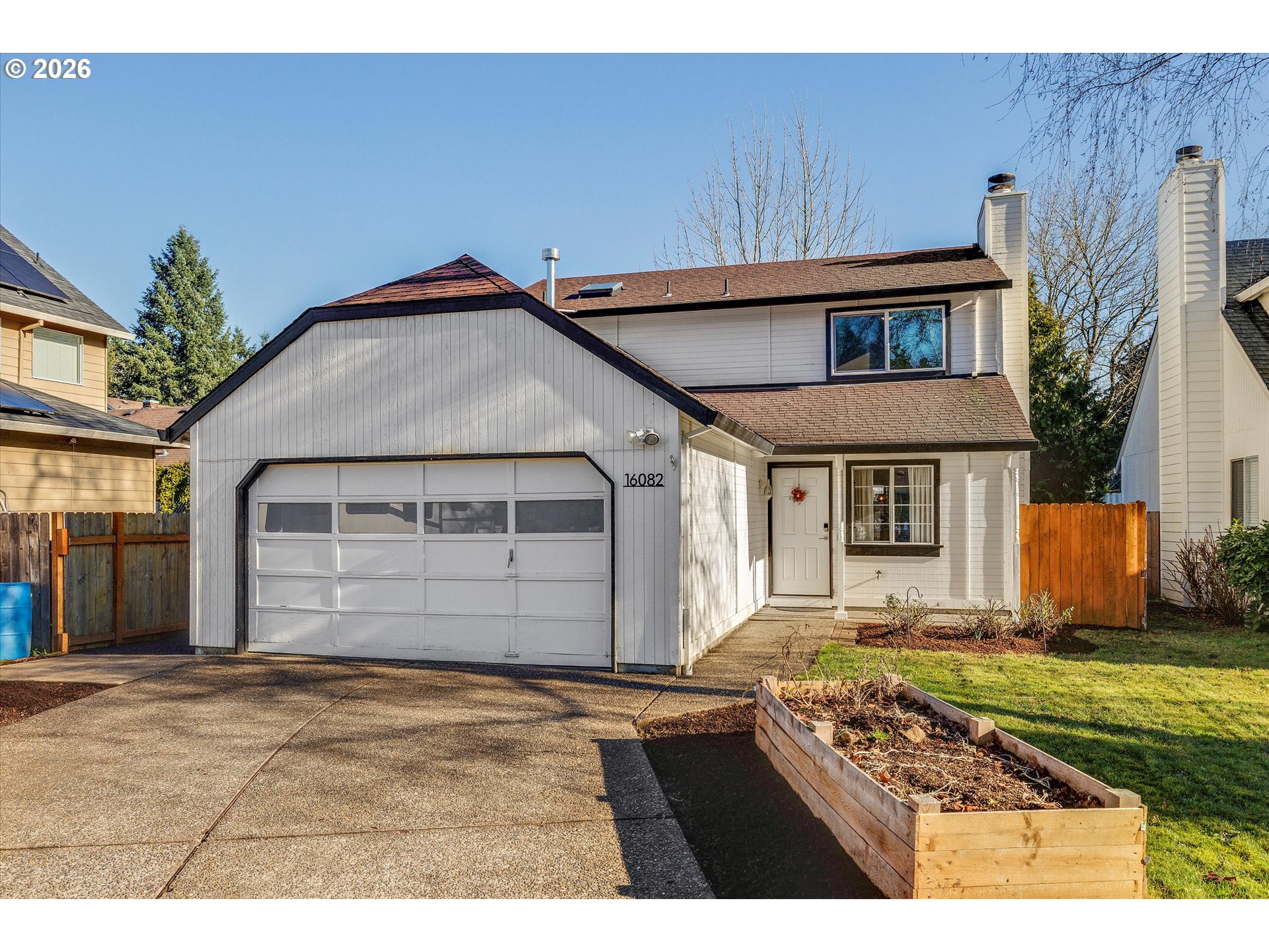 16082 Southwest 93rd Avenue Tigard, OR 97224 - Photo 2 of 35 a front view of a house with a yard
