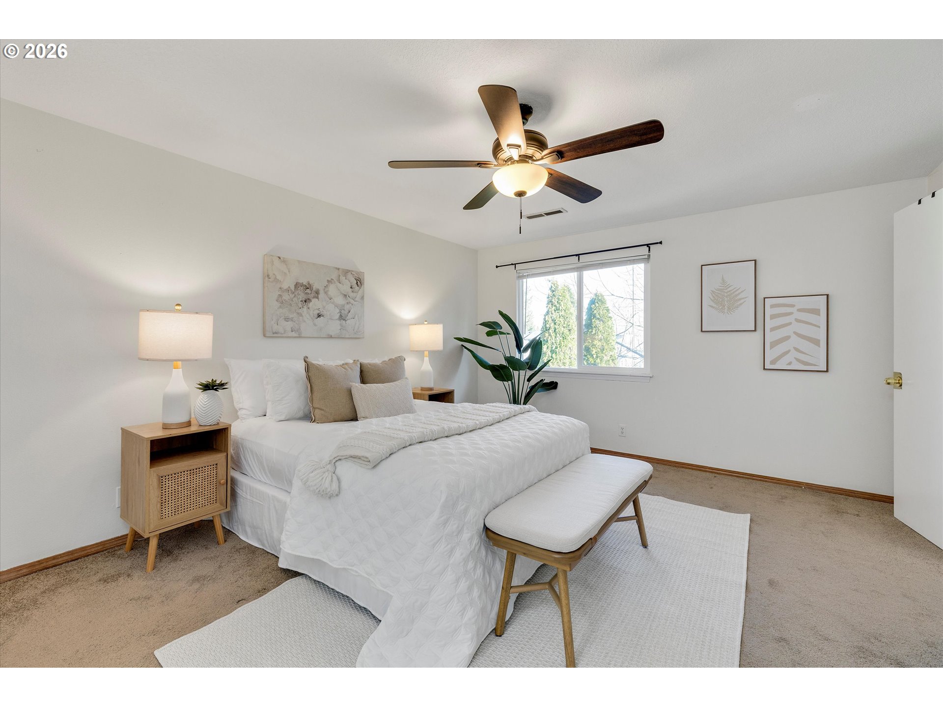16082 Southwest 93rd Avenue Tigard, OR 97224 - Photo 21 of 35 a bedroom with a bed and a chandelier