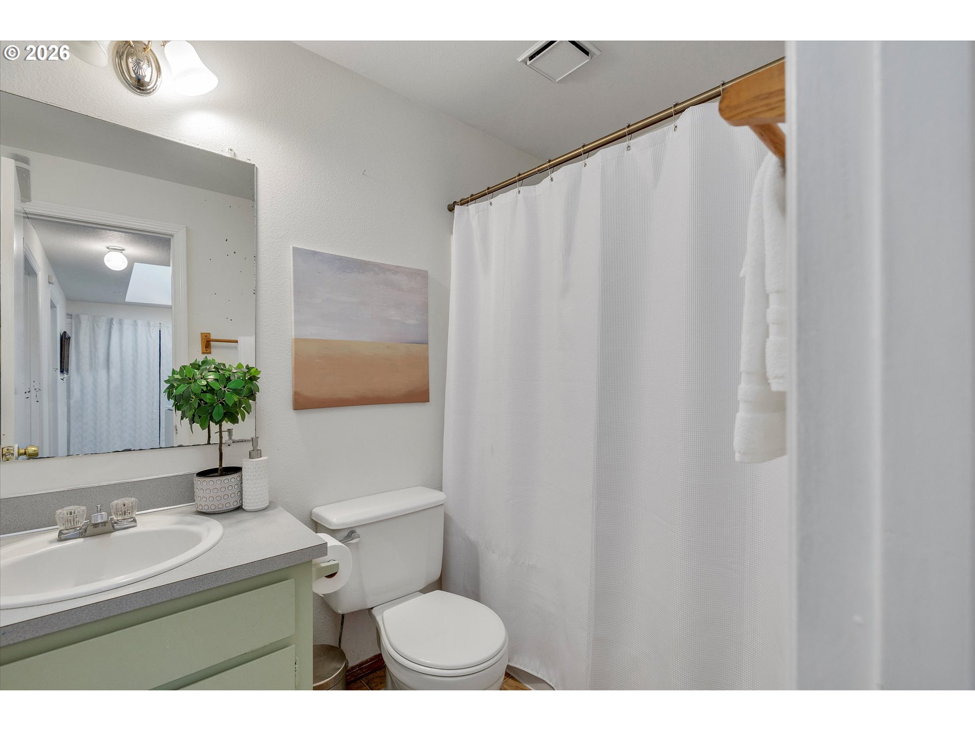 16082 Southwest 93rd Avenue Tigard, OR 97224 - Photo 27 of 35 a bathroom with a sink and a mirror