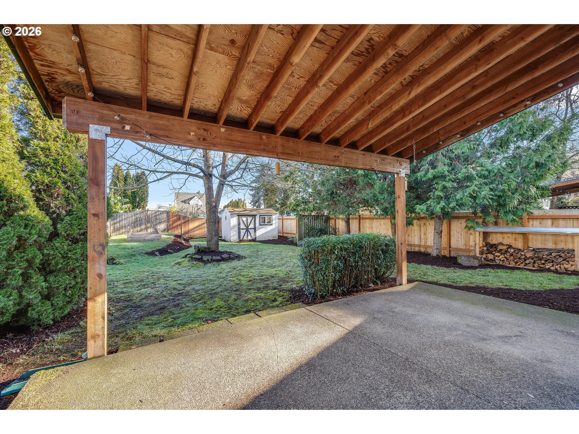 16082 Southwest 93rd Avenue Tigard, OR 97224 - Photo 29 of 35 a view of a backyard with wooden fence
