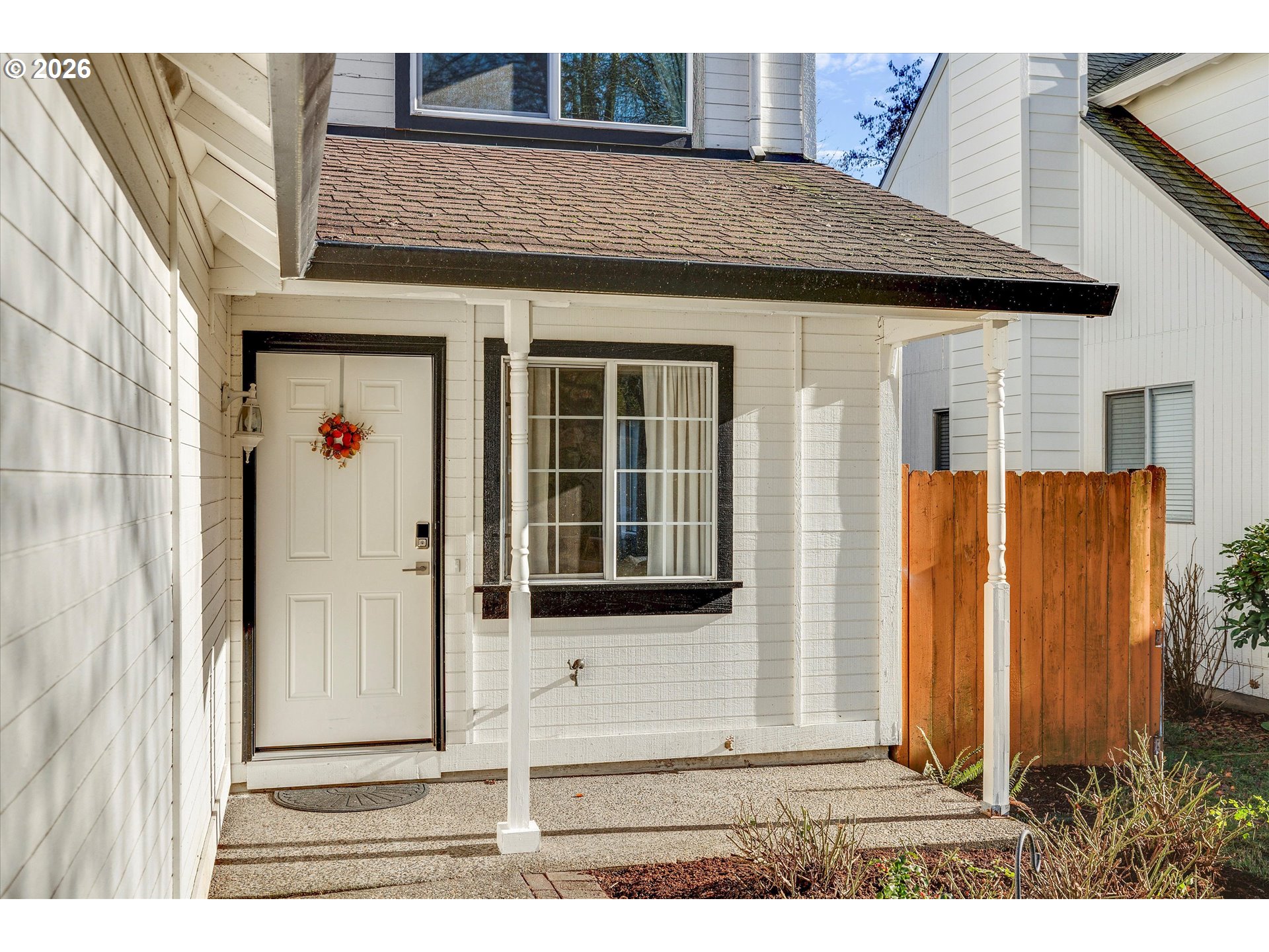 16082 Southwest 93rd Avenue Tigard, OR 97224 - Photo 3 of 35 a front view of a house with a porch