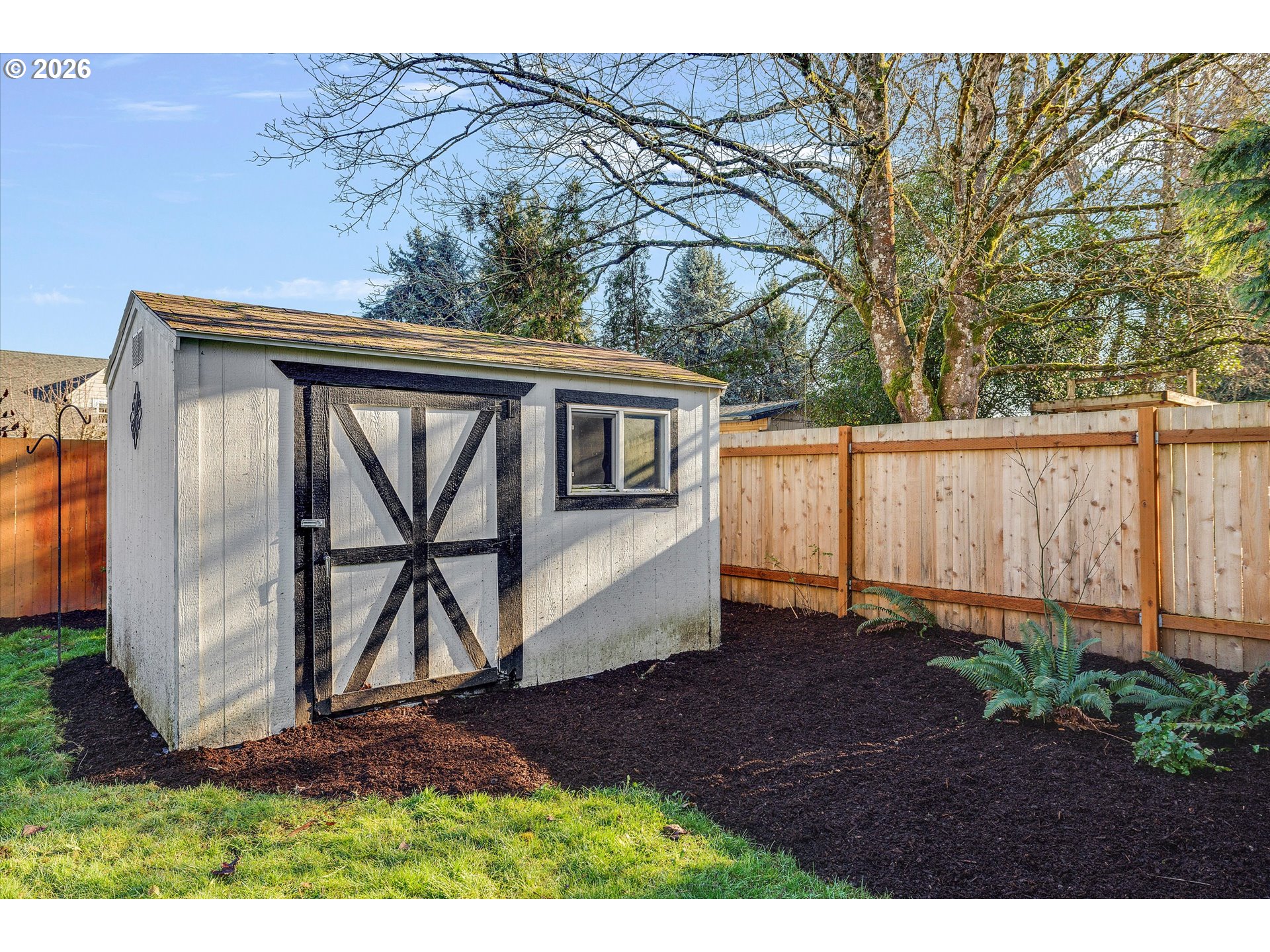 16082 Southwest 93rd Avenue Tigard, OR 97224 - Photo 33 of 35 a view of backyard with barn and a large window