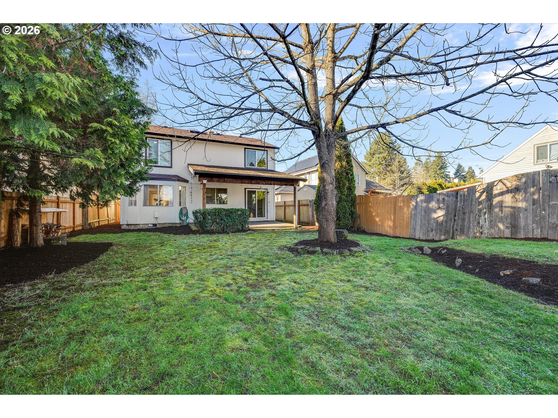 16082 Southwest 93rd Avenue Tigard, OR 97224 - Photo 34 of 35 a view of a yard with a house and garden