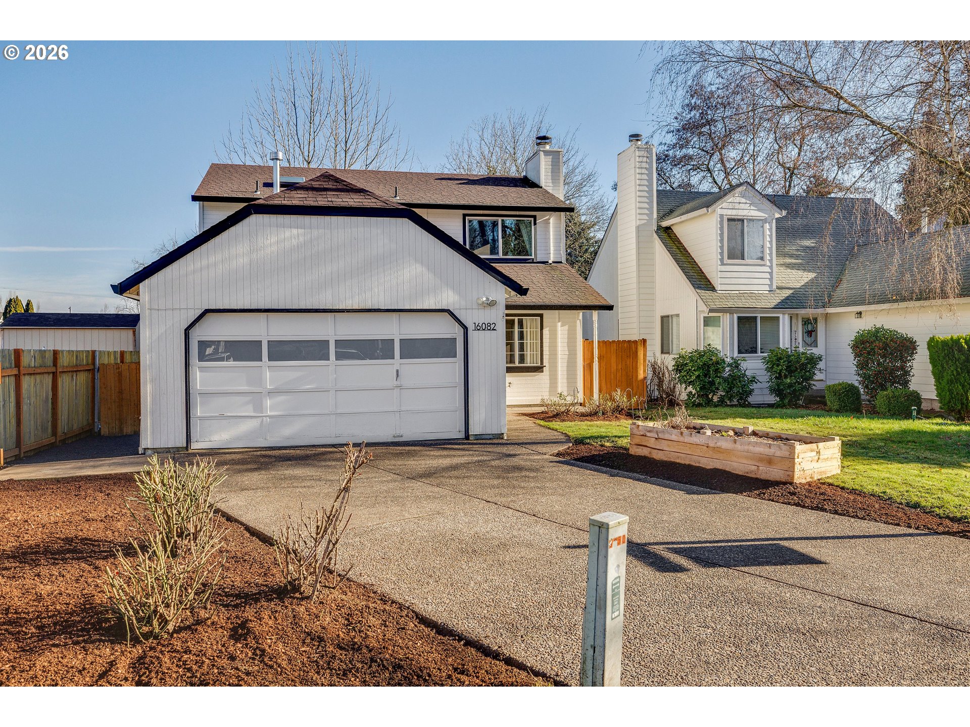 16082 Southwest 93rd Avenue Tigard, OR 97224 - Photo 35 of 35 a front view of a house with garden