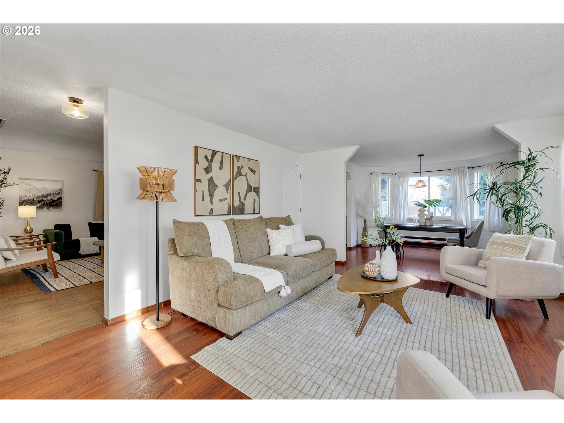 16082 Southwest 93rd Avenue Tigard, OR 97224 - Photo 5 of 35 a living room with furniture and a wooden floor