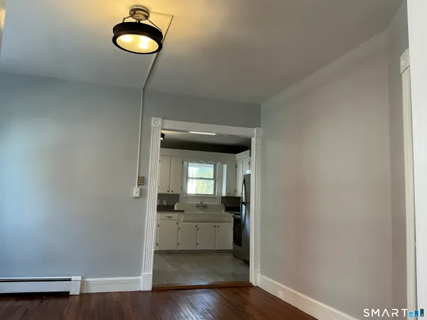 a view of a kitchen from the hallway