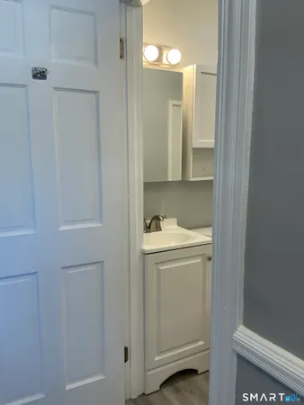 a bathroom with a sink and mirror