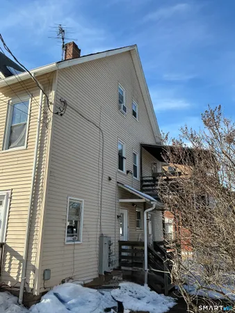 a view of a house with a tree