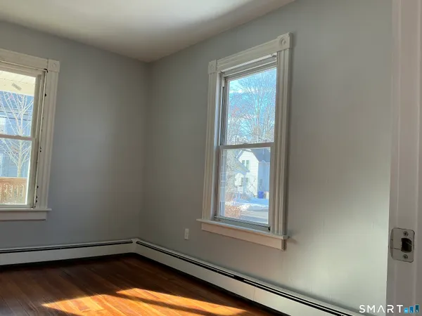 a view of a room that has a window in it