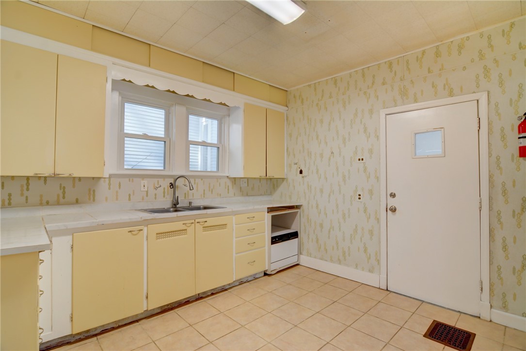 1460 West Decatur Street Decatur, IL 62522 - Photo 12 of 22 a bathroom with a sink and a mirror