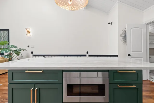 a kitchen with a sink and cabinets