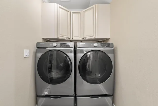a utility room with dryer and washer