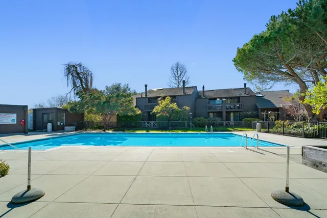 a view of outdoor space pool patio and outdoor kitchen