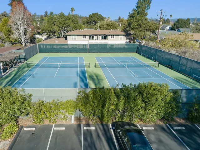 an aerial view of multiple house with yard