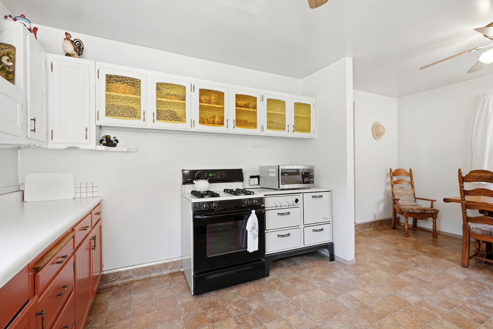 697 Loop Drive Springville, CA 93265 - Photo 20 of 55 a kitchen with a stove and white cabinets