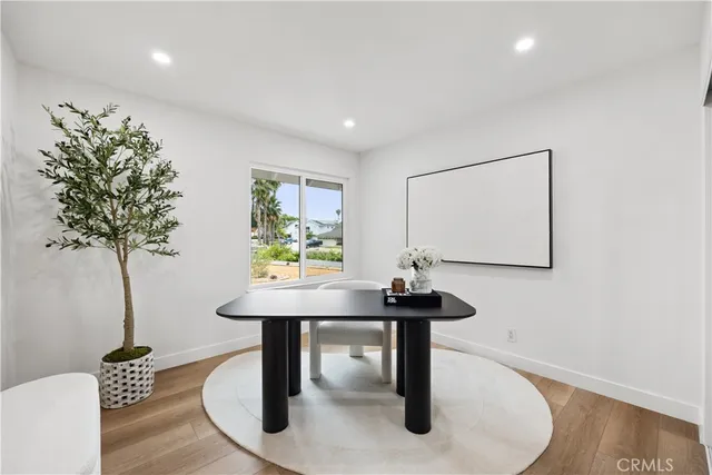 a view of a room with a table and chairs