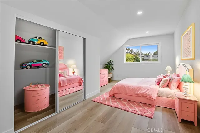 a bedroom with a bed and closet